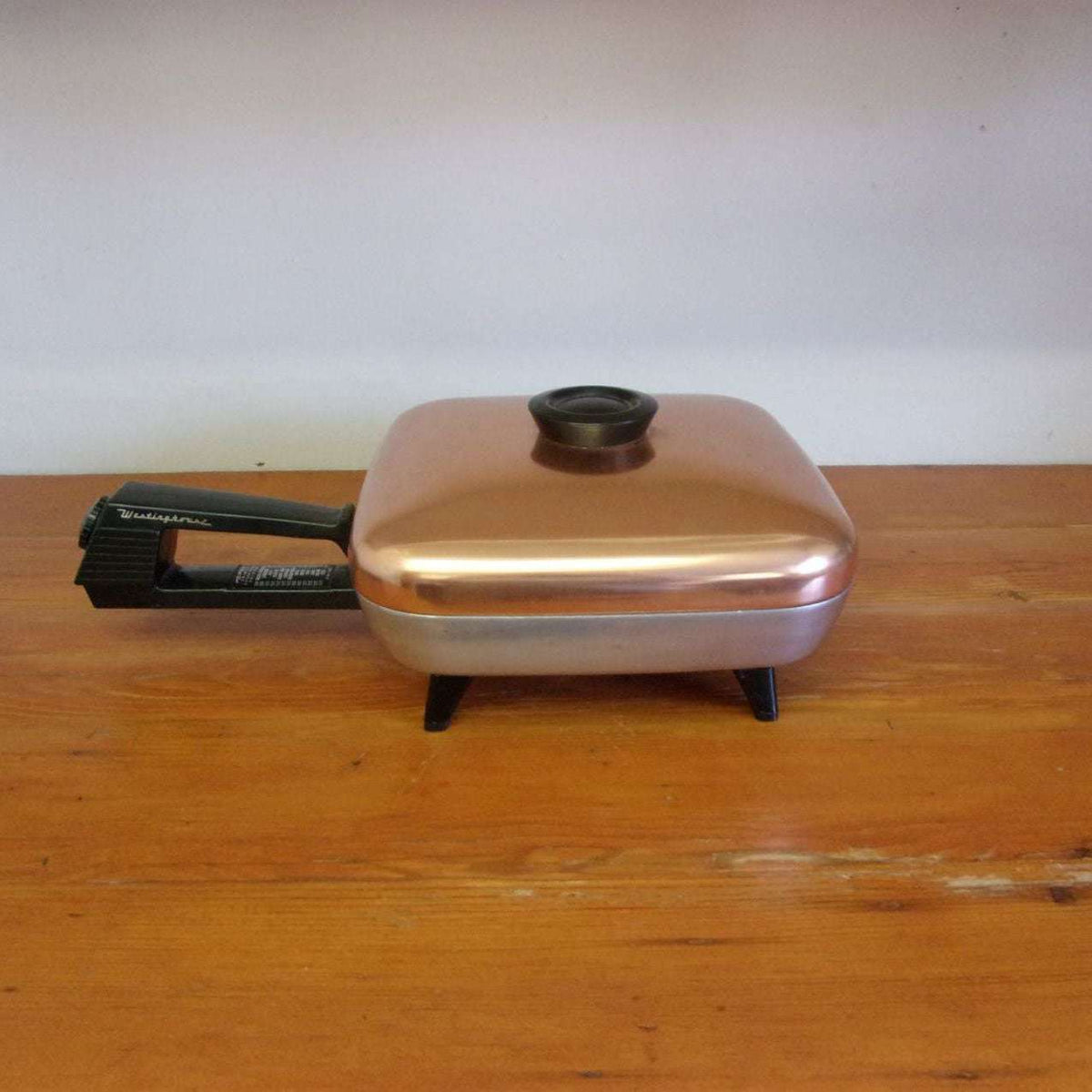 http://maandpasattic.com/cdn/shop/products/vintage-westinghouse-electric-frying-pan-with-copper-lid-retro-kitchen-appliances-fryer-cooker-ma-and-pas-attic-31959643_1200x1200.jpg?v=1676060030