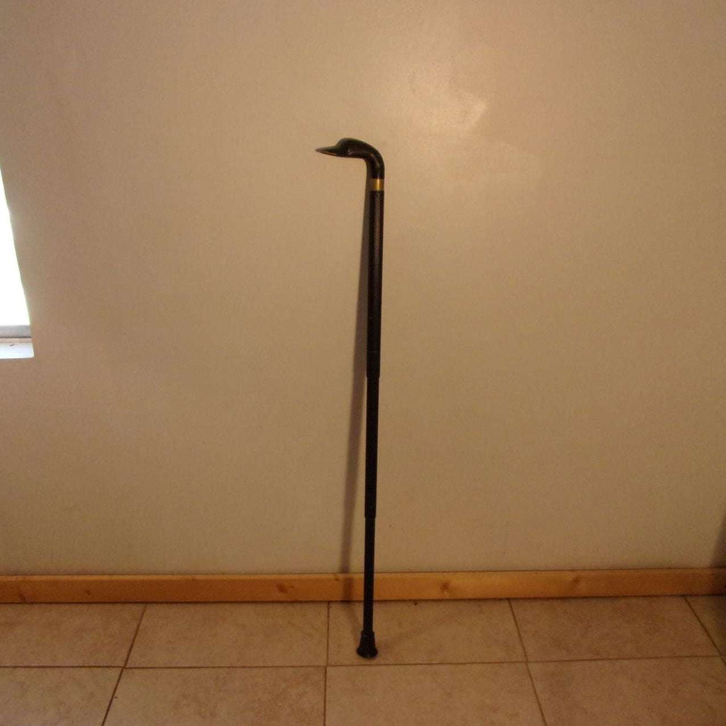 https://maandpasattic.com/cdn/shop/files/antique-vintage-brass-duck-head-cane-walking-stick-014-adjustable-canes-walking-sticks-ma-and-pas-attic-32628684_1024x1024.jpg?v=1693522218