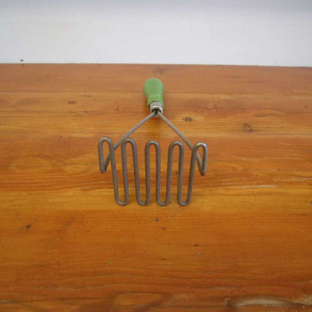 https://maandpasattic.com/cdn/shop/files/antique-vintage-potato-masher-with-green-with-white-bands-handle-kitchen-tools-gadgets-primitive-ma-and-pas-attic-32293011_1024x1024.jpg?v=1683068314