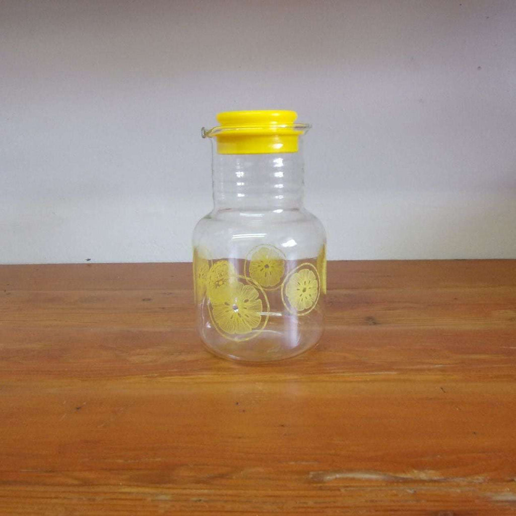 https://maandpasattic.com/cdn/shop/products/vintage-pyrex-juice-carafe-with-lemon-print-vintage-pyrex-yellow-pyrex-ma-and-pas-attic-31382094_1024x1024.jpg?v=1660771876