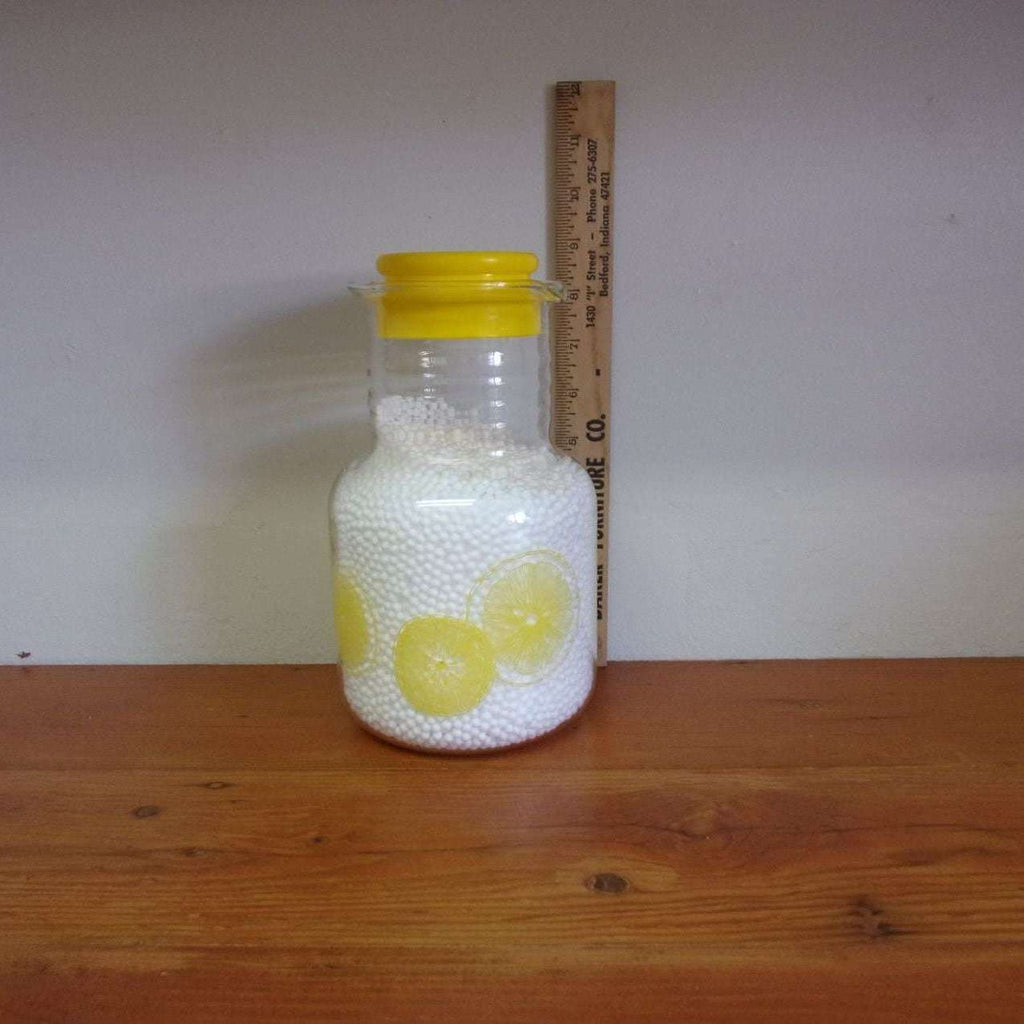 https://maandpasattic.com/cdn/shop/products/vintage-pyrex-juice-carafe-with-lemon-print-vintage-pyrex-yellow-pyrex-ma-and-pas-attic-31382118_1024x1024.jpg?v=1660771908