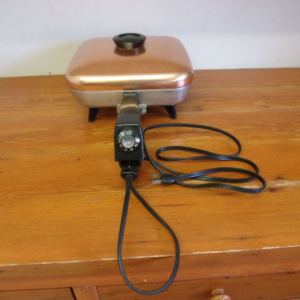 https://maandpasattic.com/cdn/shop/products/vintage-westinghouse-electric-frying-pan-with-copper-lid-retro-kitchen-appliances-fryer-cooker-ma-and-pas-attic-31959651_1024x1024.jpg?v=1676060045